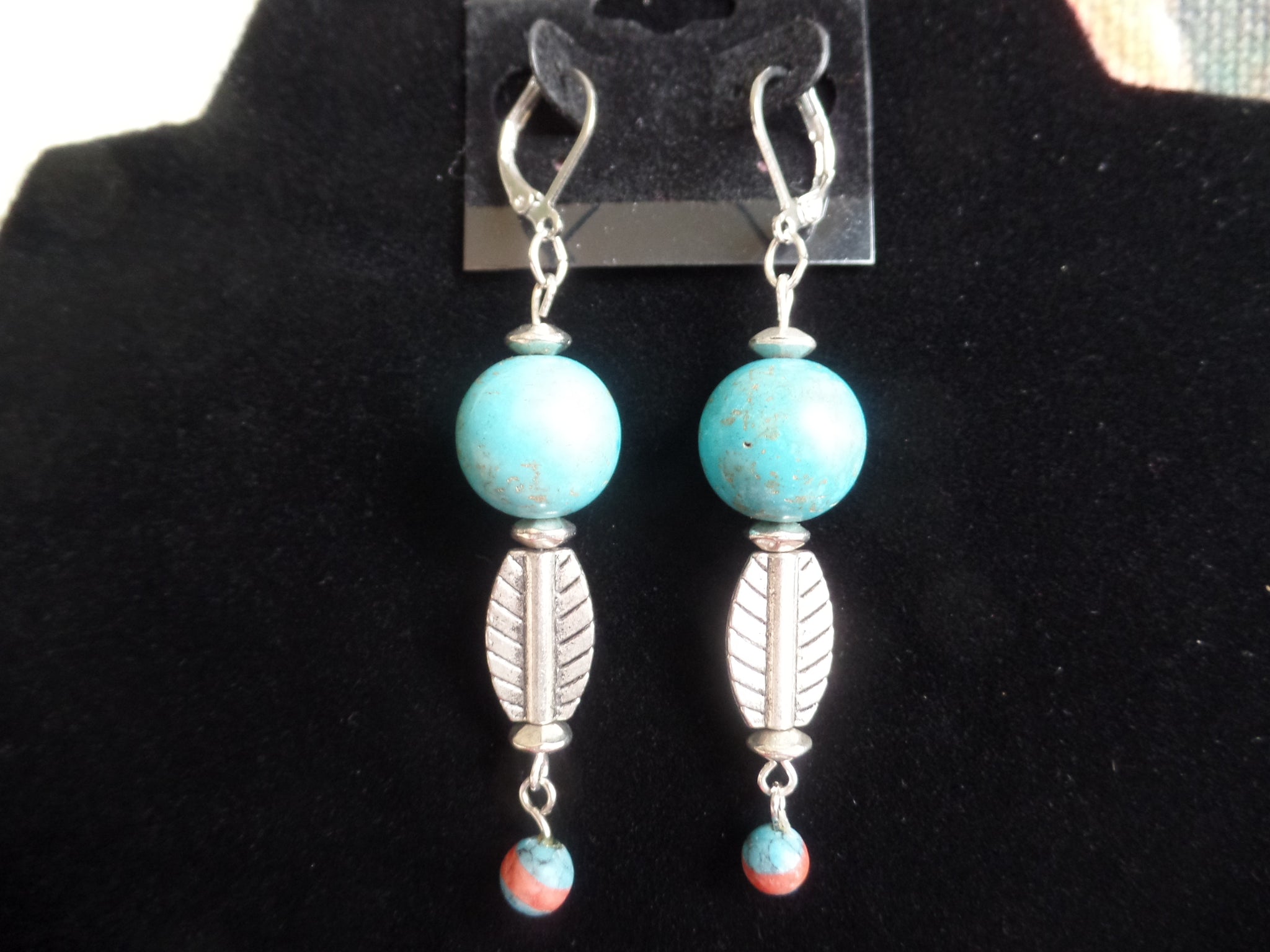 Turquoise Acrylic Rounds w/silver leaf accents on Stainless Steel Clasp.