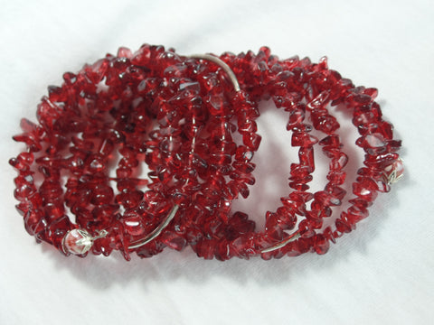 Red Rock Glass beads w/ curved silver accent beads on memory wire.